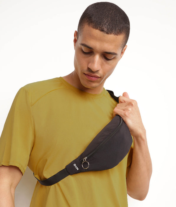 DIM DIM Move unisex zwart heuptasje met rits