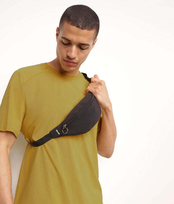 DIM DIM Move unisex zwart heuptasje met rits